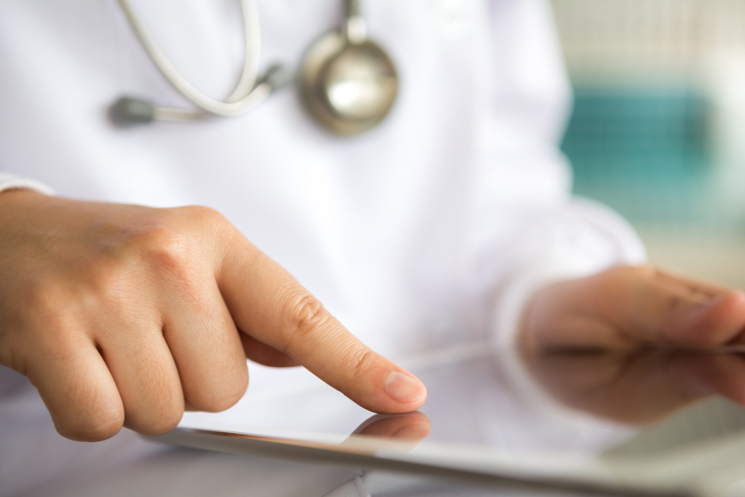 Doctor using tablet computer